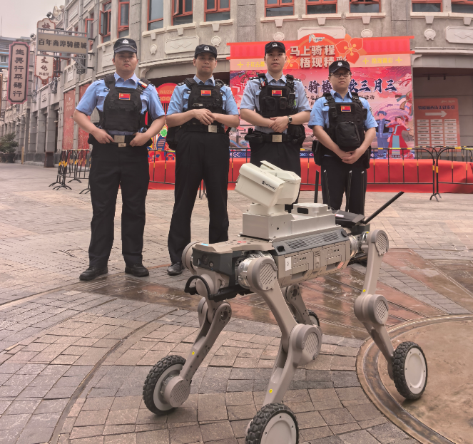 Security personnel and quadruped robot deployed at public venue entrance for identity verification