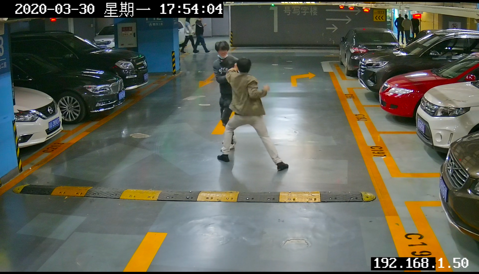 Security camera footage showing abnormal behavior detection in underground mall parking area